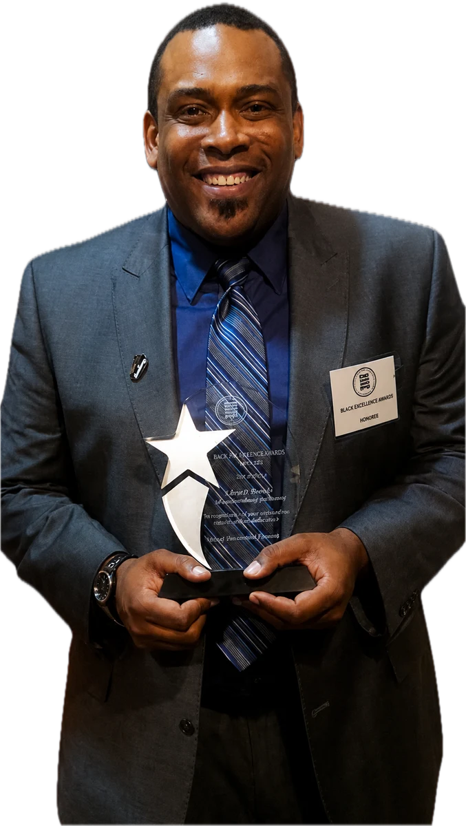 Daryl D. Brooks holding the Black Excellence Award for Outstanding Director