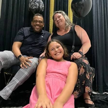 Daryl D. Brooks with his family, daughter Maya in front